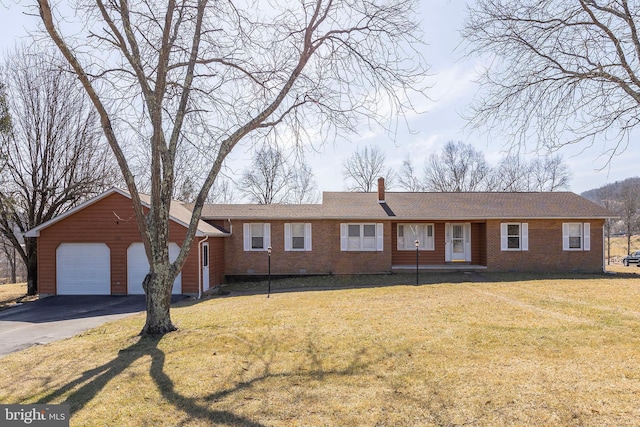 single story home with a front lawn and a garage