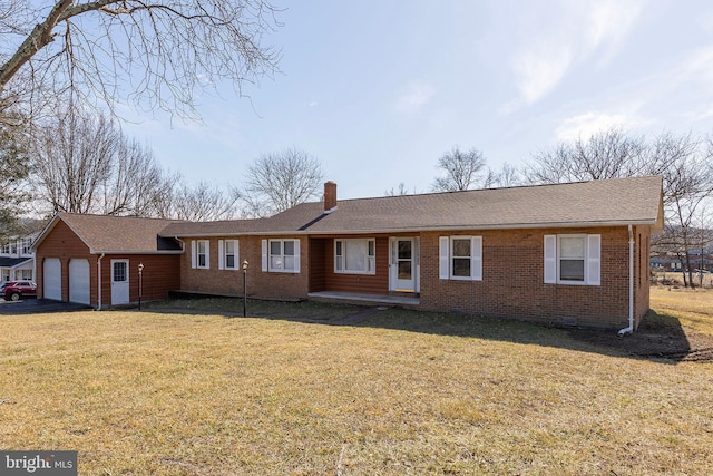 single story home with a front lawn and a garage