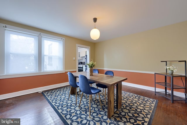 dining room with dark hardwood / wood-style floors