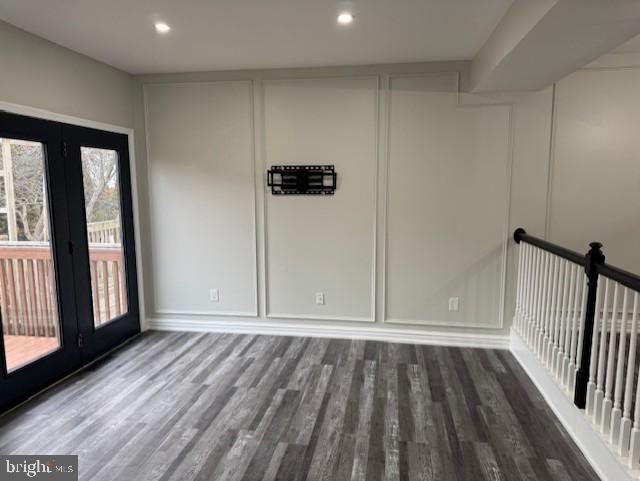 unfurnished room featuring dark hardwood / wood-style flooring