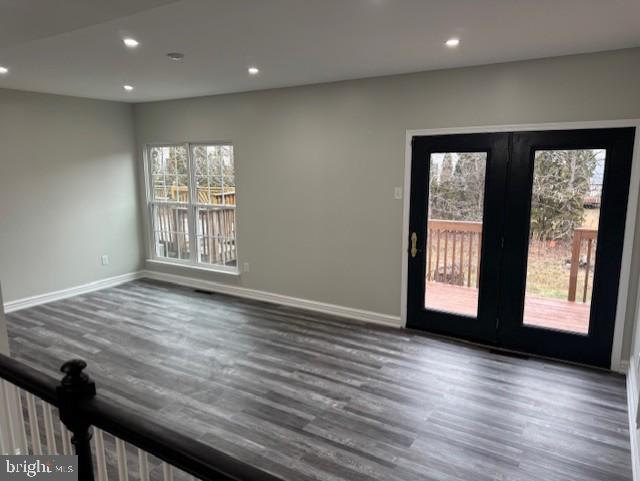 interior space with dark wood-type flooring and french doors