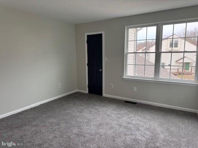 unfurnished room with carpet flooring