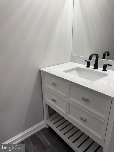 bathroom featuring vanity and hardwood / wood-style floors