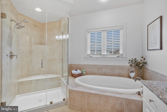 bathroom featuring vanity and plus walk in shower