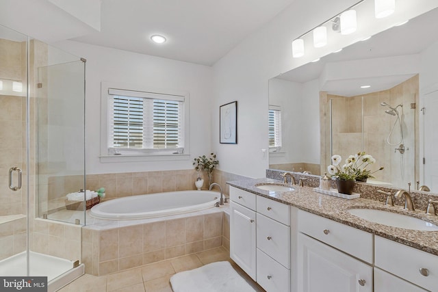 bathroom featuring tile patterned flooring, vanity, plenty of natural light, and independent shower and bath