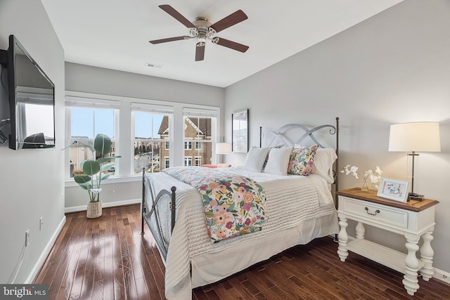 bedroom featuring dark hardwood / wood-style floors and ceiling fan