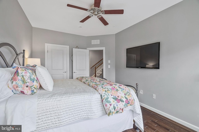 bedroom featuring ceiling fan and dark hardwood / wood-style flooring