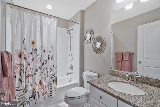 full bathroom featuring shower / tub combo, vanity, and toilet