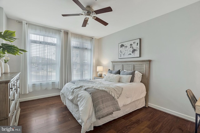 bedroom featuring dark wood-type flooring and ceiling fan