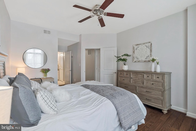 bedroom with dark hardwood / wood-style floors and ceiling fan