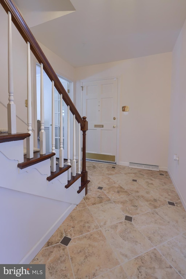 foyer entrance with a baseboard radiator