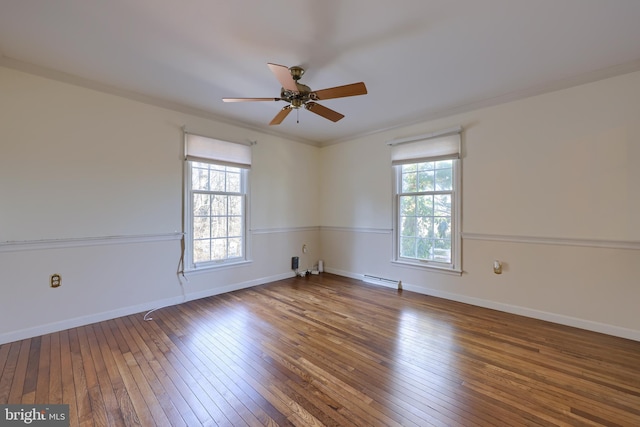 unfurnished room featuring hardwood / wood-style flooring, crown molding, a wealth of natural light, and ceiling fan