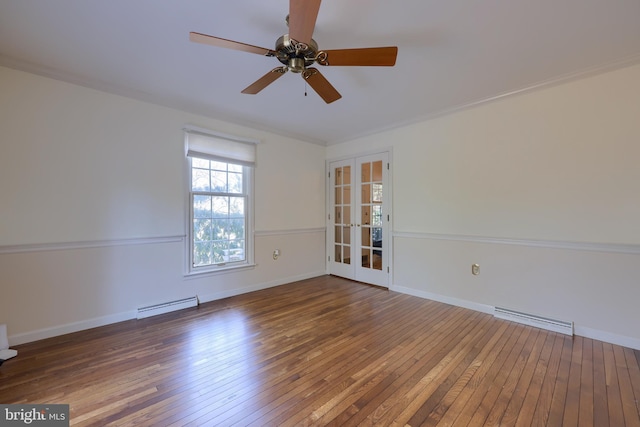 spare room featuring a baseboard radiator, dark wood-type flooring, ceiling fan, and french doors