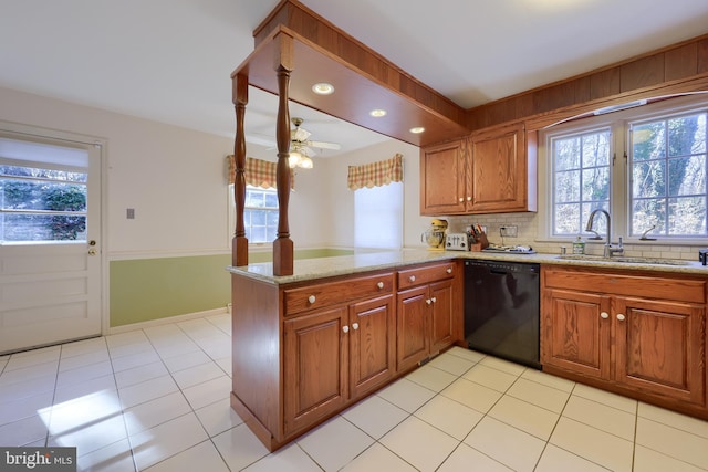 kitchen with sink, decorative backsplash, kitchen peninsula, and black dishwasher