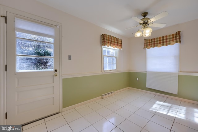 interior space featuring ceiling fan and light tile patterned floors