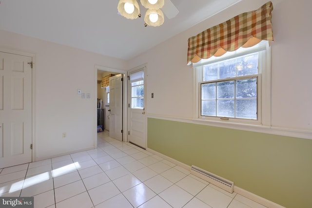 spare room featuring light tile patterned floors