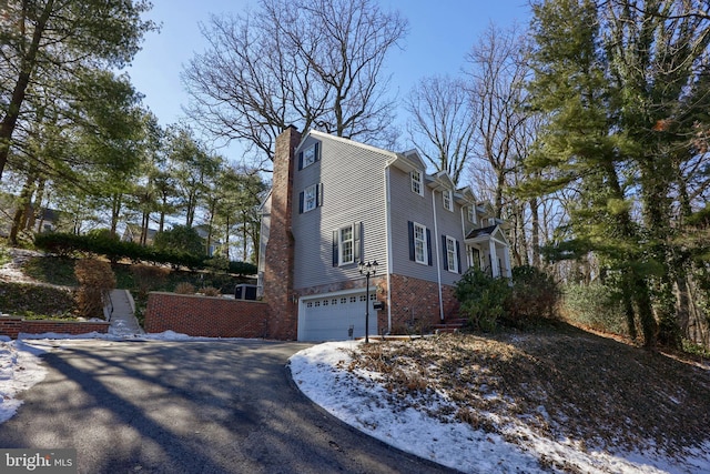 exterior space with a garage