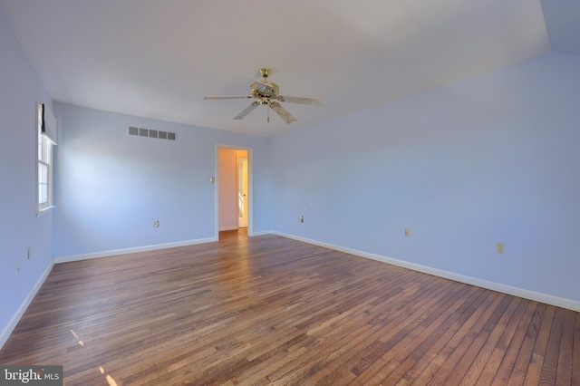 spare room featuring dark hardwood / wood-style floors and ceiling fan