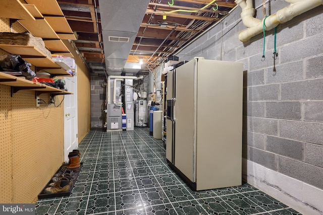 basement with water heater and heating unit