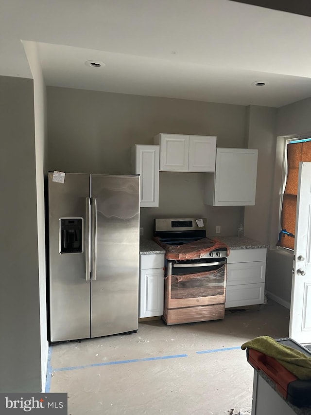 kitchen featuring white cabinetry and stainless steel appliances