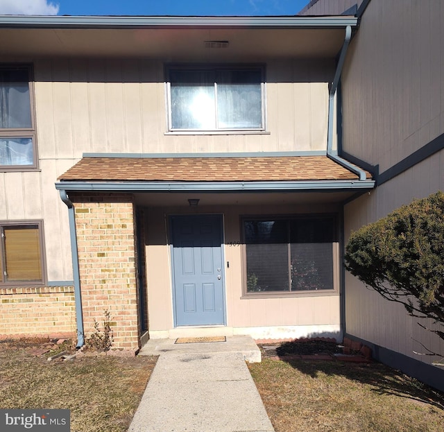 entrance to property with a yard