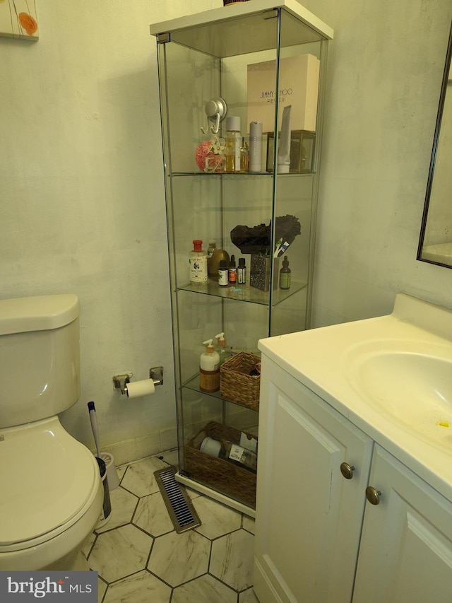 bathroom featuring vanity and toilet