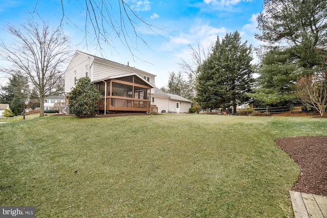 exterior space featuring a lawn and a sunroom