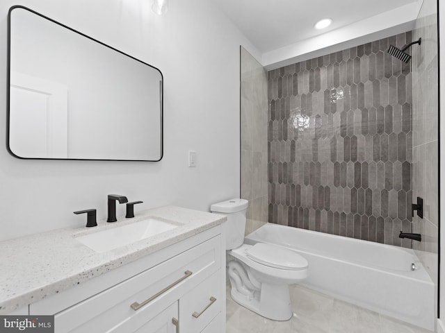 full bathroom with vanity, toilet, and tiled shower / bath