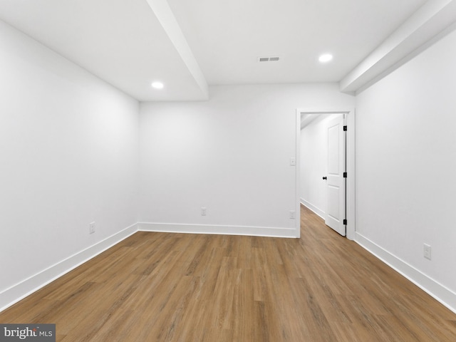 empty room featuring wood-type flooring