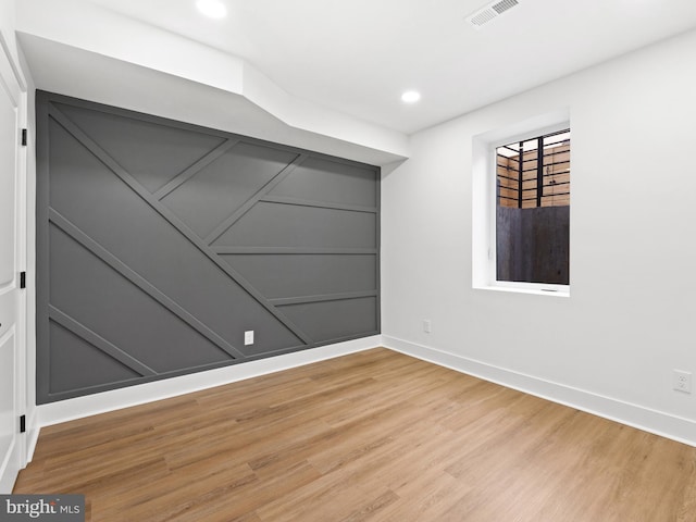 unfurnished room featuring hardwood / wood-style floors