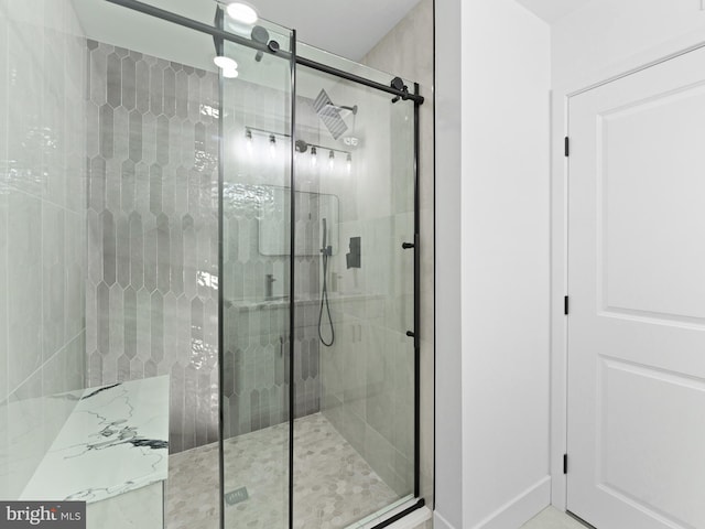 bathroom featuring an enclosed shower