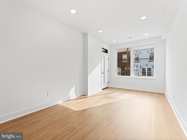 spare room featuring light hardwood / wood-style floors