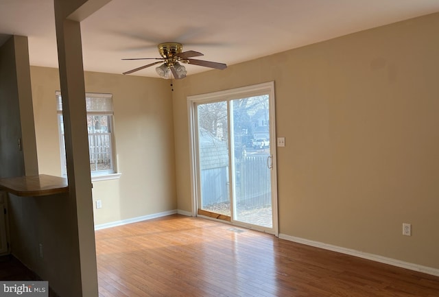 spare room with ceiling fan and light hardwood / wood-style flooring