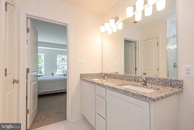 1404 N Chase St, Ocean Pines, MD 21811 - ensuite bathroom featuring double vanity, marble look tiles, a shower with shower door, and baseboards