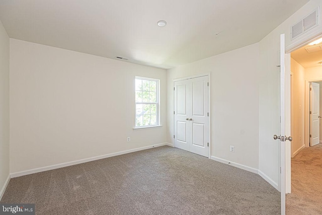 1404 N Chase St, Ocean Pines, MD 21811 - unfurnished bedroom with carpet, baseboards, and a closet