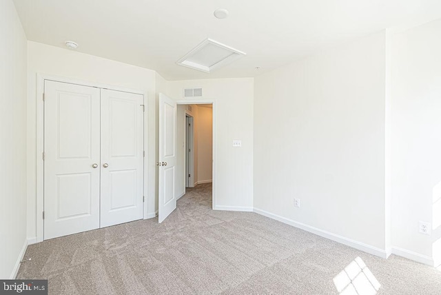 1404 N Chase St, Ocean Pines, MD 21811 - unfurnished bedroom with attic access, light carpet, a closet, and baseboards