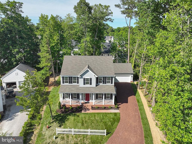1404 N Chase St, Ocean Pines, MD 21811 - colonial house featuring a porch, dirt driveway, and a front lawn