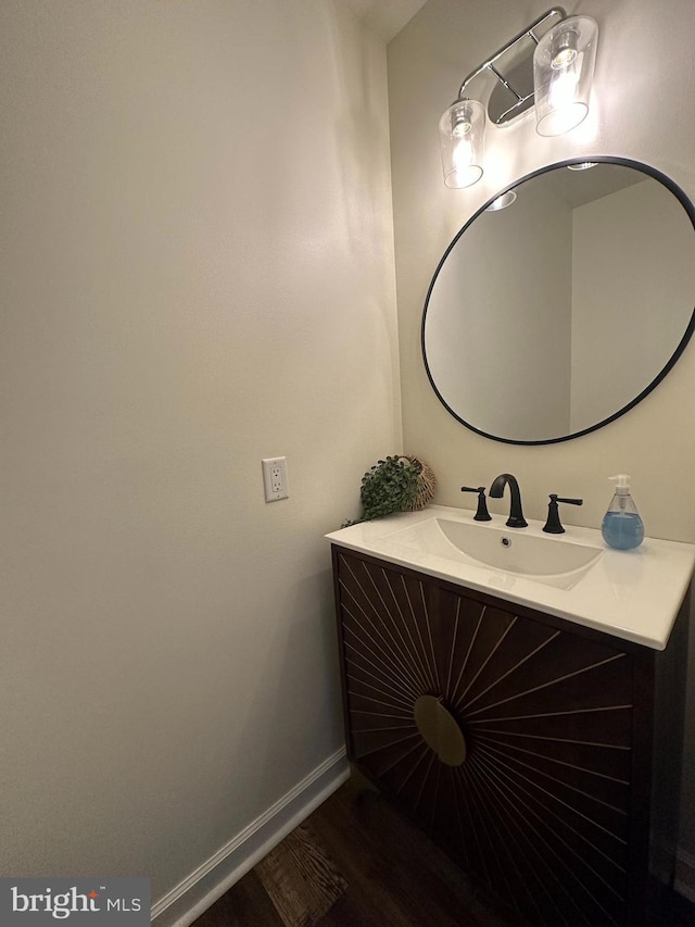 bathroom with vanity and hardwood / wood-style floors