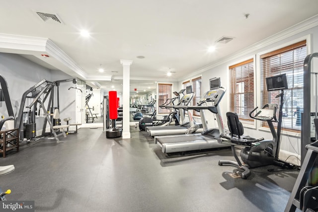 gym featuring ornamental molding and decorative columns