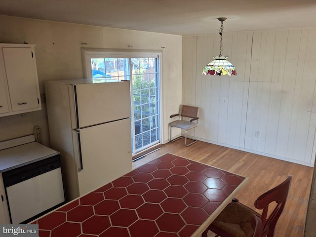 unfurnished dining area with light hardwood / wood-style floors