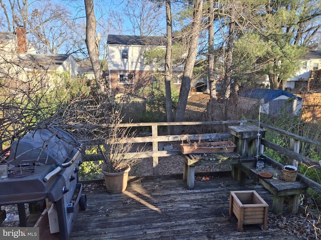 wooden terrace with area for grilling