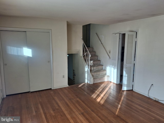 entrance foyer with dark hardwood / wood-style floors