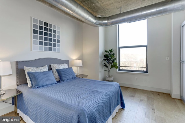 bedroom featuring light wood-type flooring