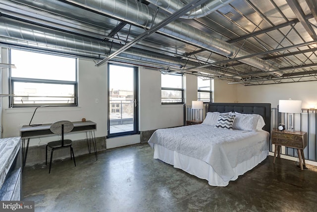 bedroom featuring multiple windows and access to exterior