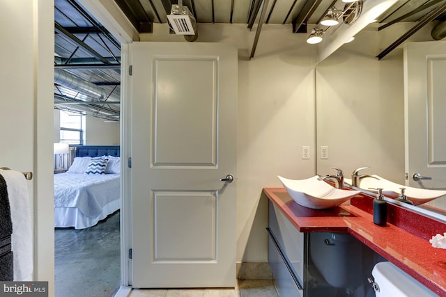 bathroom with vanity and toilet