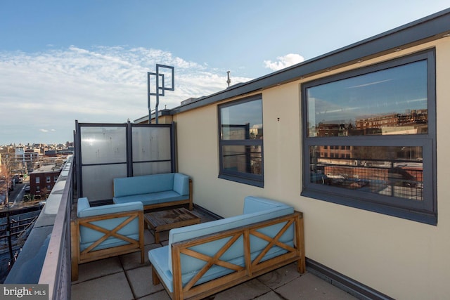 view of patio / terrace with an outdoor living space and a balcony