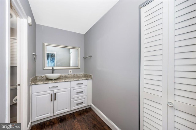 bathroom featuring hardwood / wood-style flooring and vanity