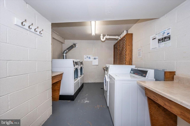 washroom featuring washer and clothes dryer