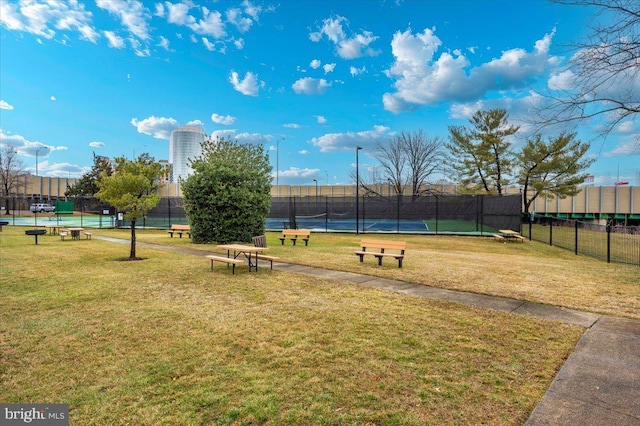 view of property's community featuring a yard