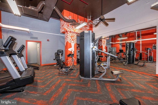 exercise room with ceiling fan